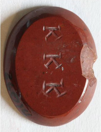 Stomach amulet verso