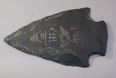 Inscribed projectile point-shaped slab