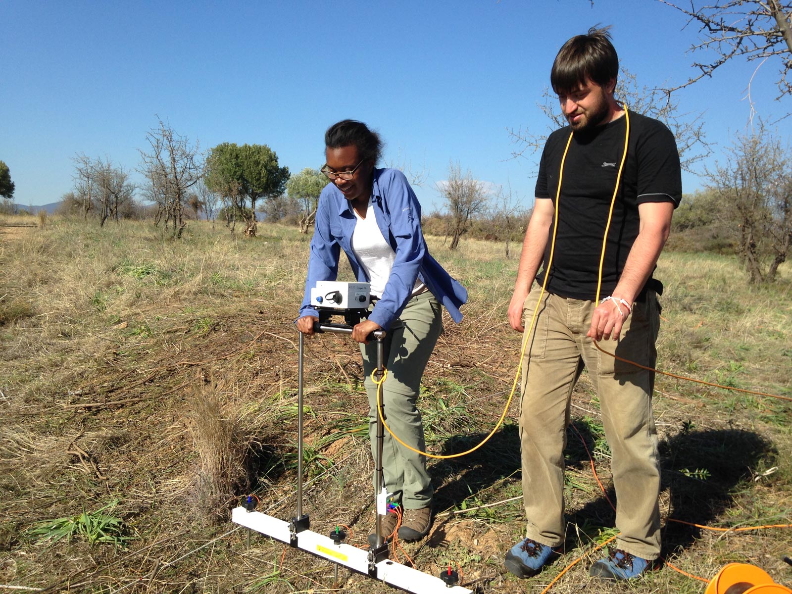 Archaeology students carrying out geophysical survey